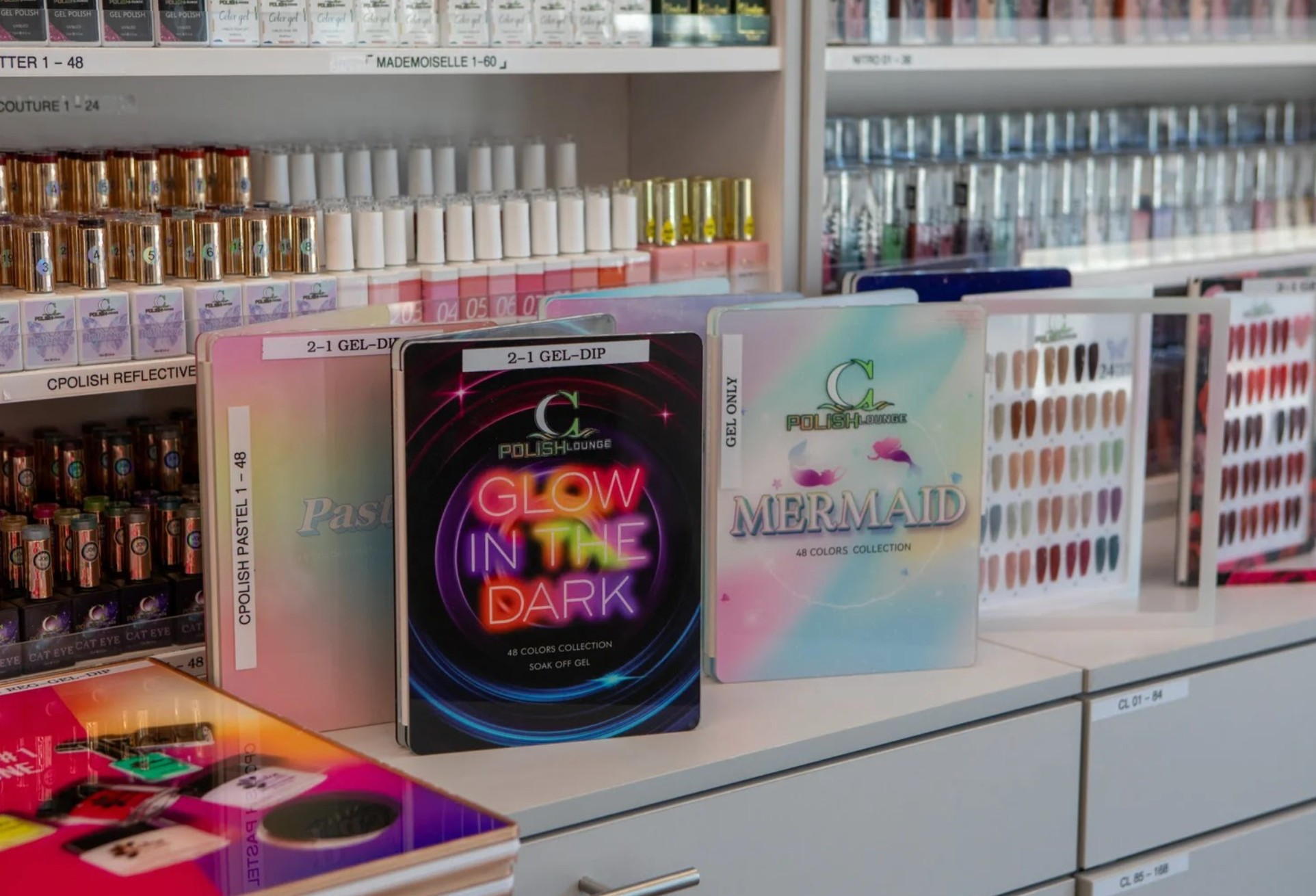 Shelves of premium gel and dip polish colors at Constance Polish Lounge