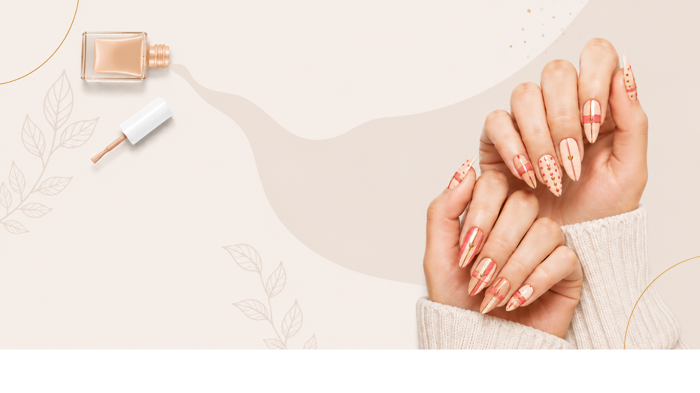 Hands with soft beige and pink nail art beside a bottle of nail polish